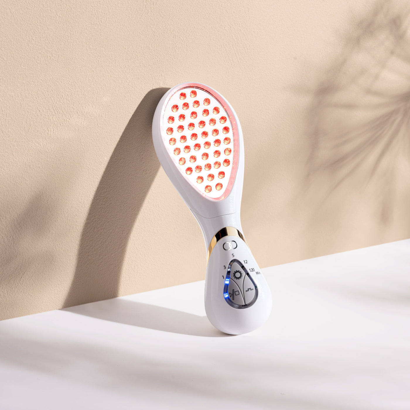 Handheld LumaGlow Red LED wand featuring continuous and pulsating modes for skin repair.